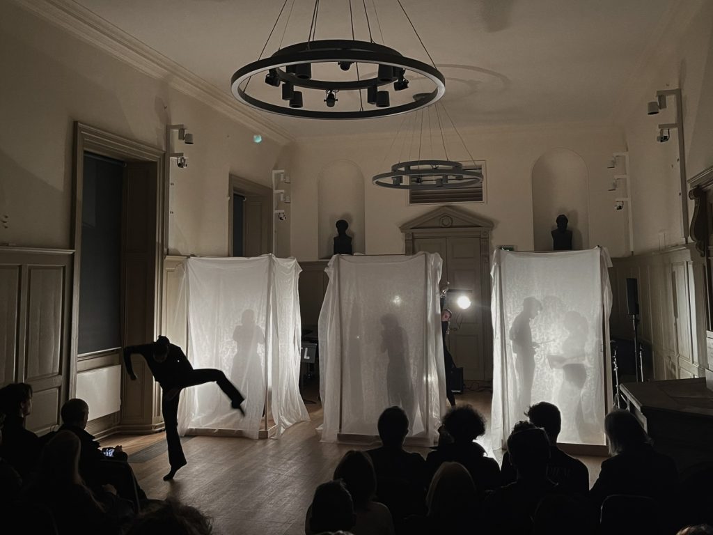 Boxes being performed at Trinity Laban with dancer posing.